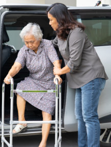 woman taking care of elderly