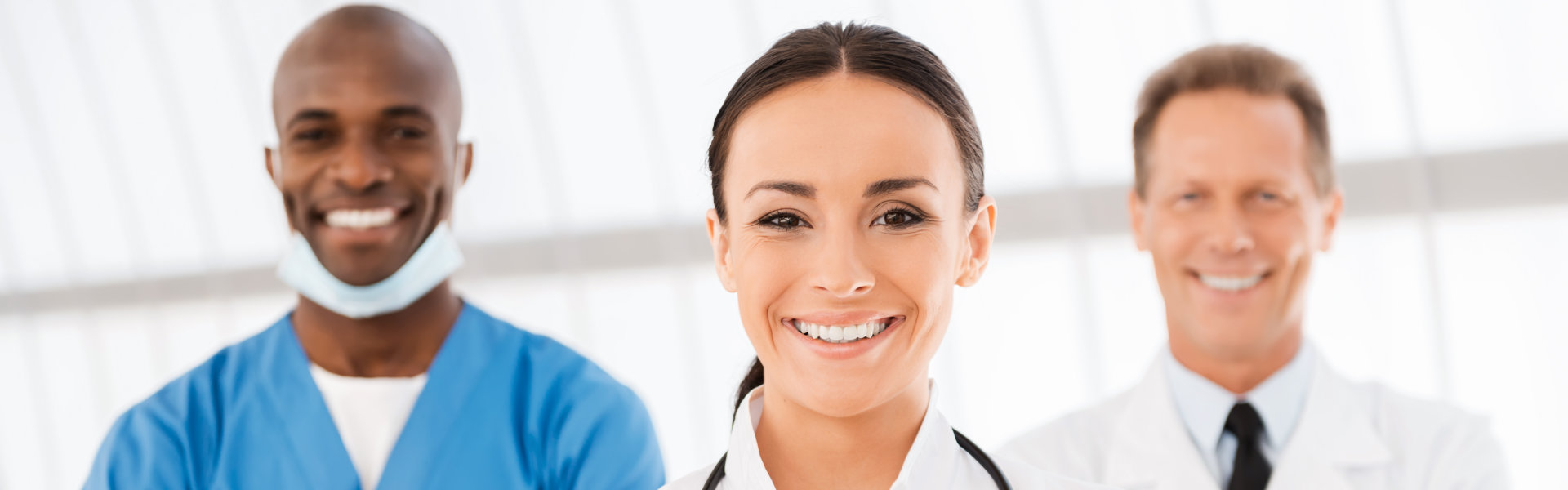 Three medical staff smiling